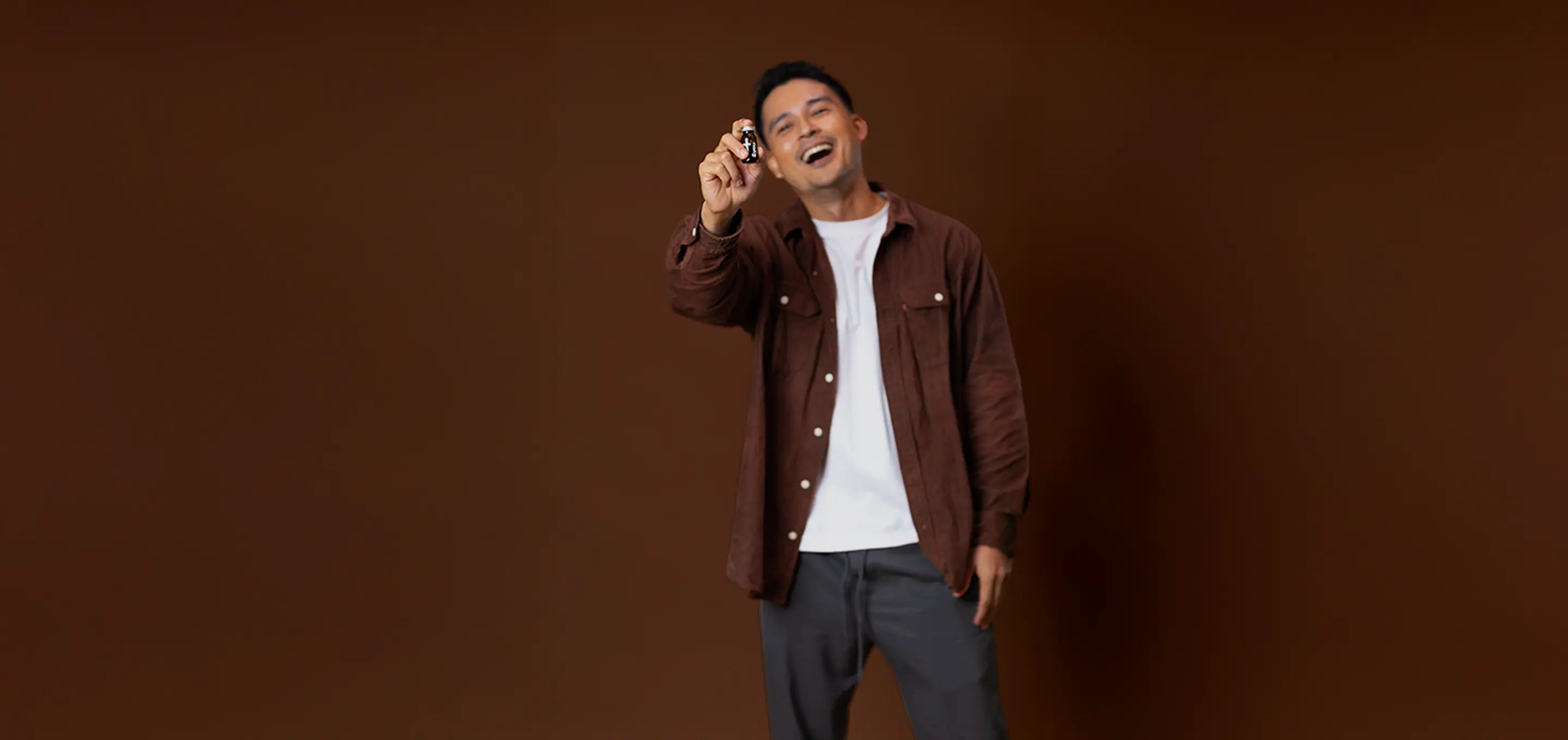 Man holding AndYou product bottle